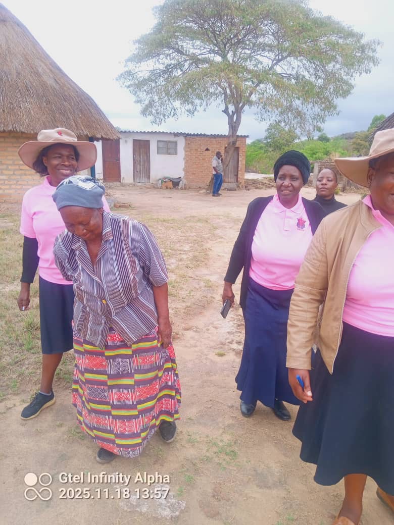 Muzita Life Legacy team members conducting a home visit for an elderly community member