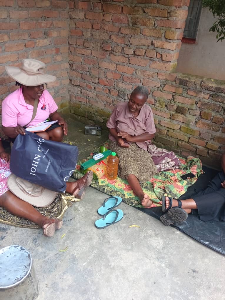 A team member providing home-based care to an elderly woman
